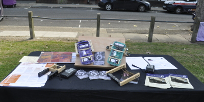 A table with bat detectors, leaflets and my datasniffer devices