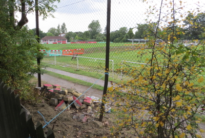 A photograph of a sports ground with many red objects
